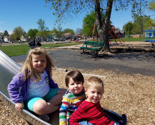 20170423_115526 Kids playing on a slide.
